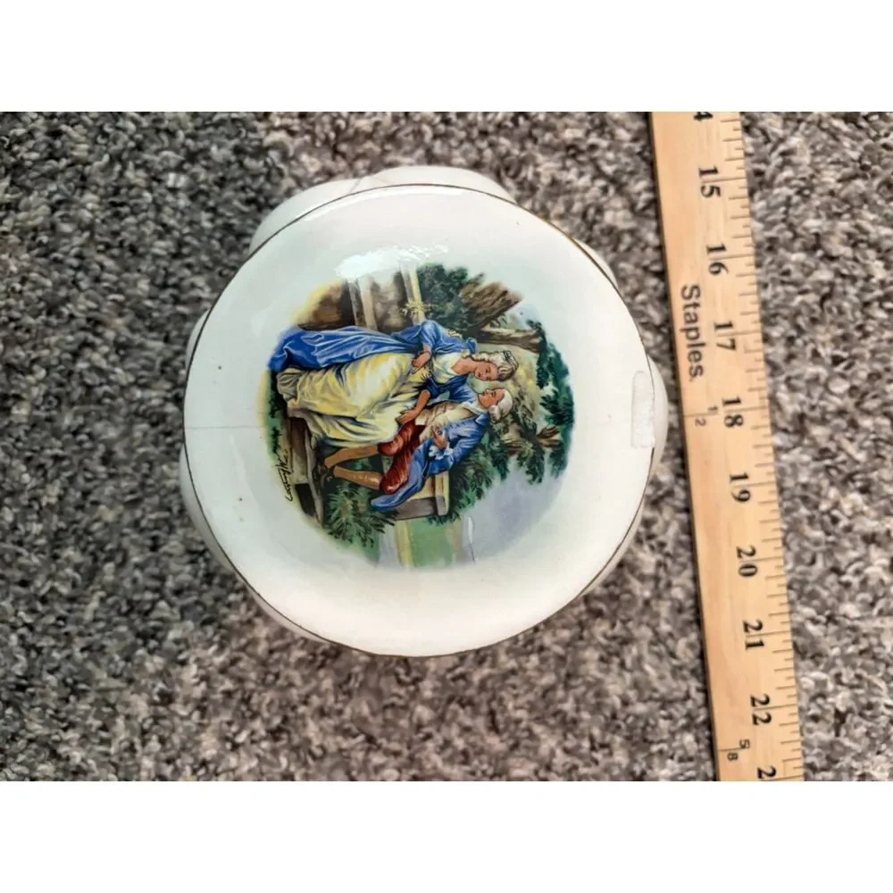 Vtg. Round Porcelain Trinket box with romantic couple scene